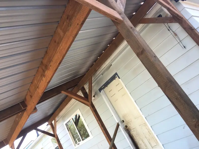 Patio cover construction with metal roof and beams, Albany OR